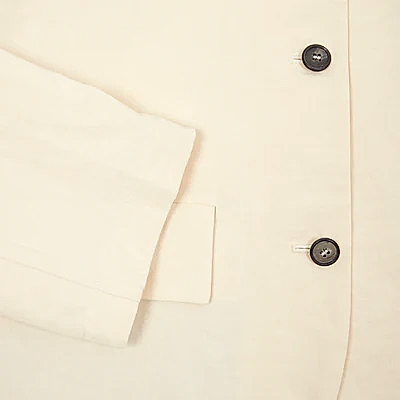 Bea jacket is an oversized blazer in a beautiful off-white Cotton/Linen fabric. Notched lapel, dropped shoulder with three button fastening, two flap pockets.   72% Cotton, 28% Linen. 